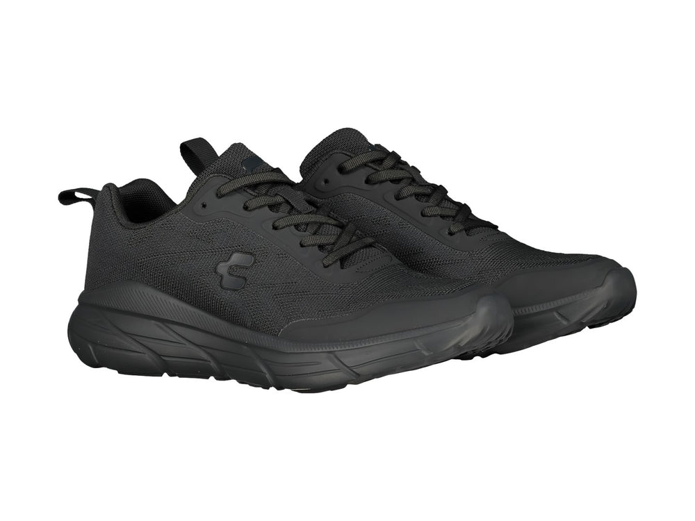 Tenis deportivos Charly en color negro con suela gruesa y parte superior de malla transpirable.