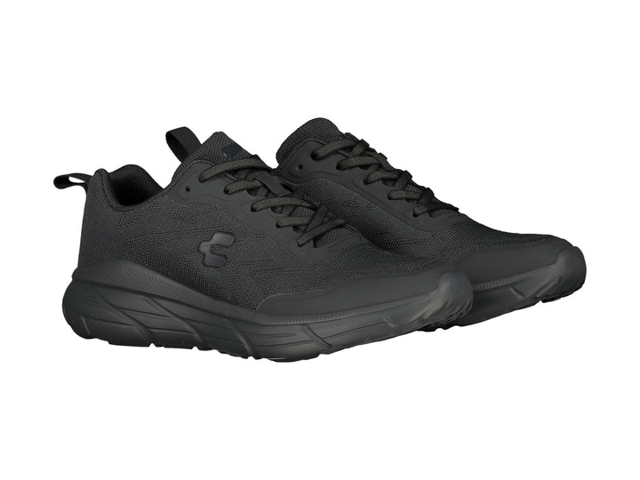 Tenis deportivos Charly en color negro con suela gruesa y parte superior de malla transpirable.
