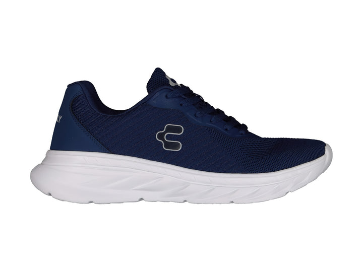 Tenis deportivos Charly en color azul marino con suela blanca y logotipo lateral blanco.
