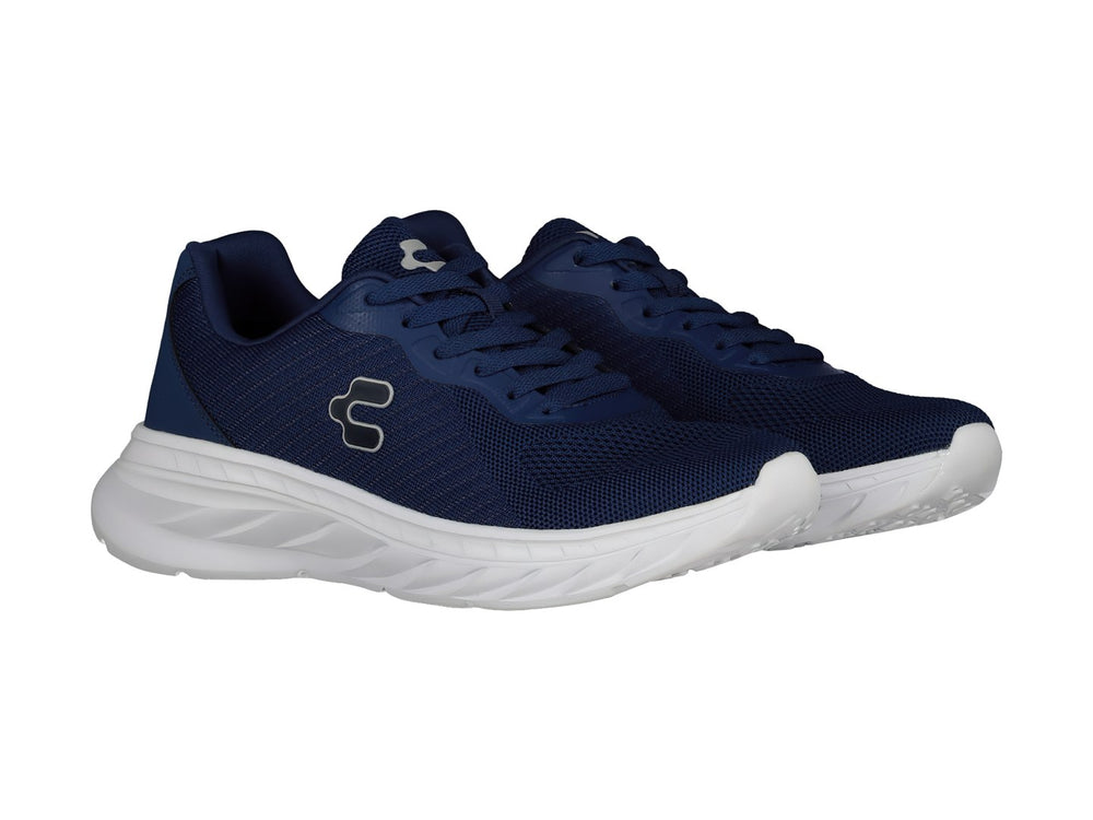 Tenis deportivos Charly en color azul marino con suela blanca y logotipo lateral blanco.