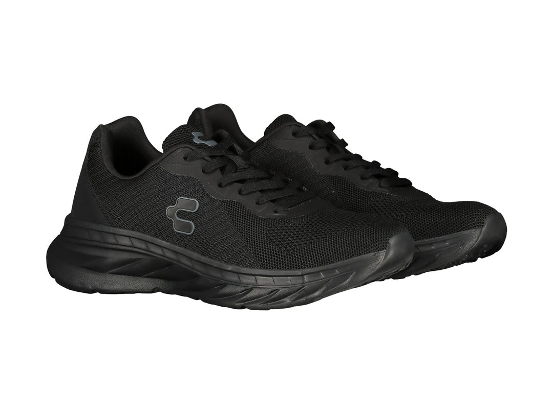Tenis deportivos Charly color negro con tejido transpirable y suela robusta.