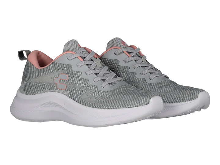 Tenis deportivos Charly color gris con suela blanca y detalles en rosa.