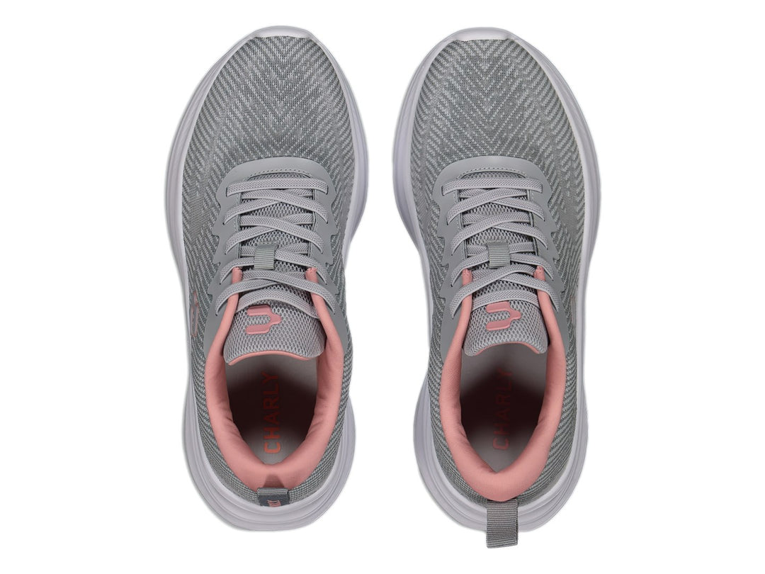 Tenis deportivos Charly color gris con suela blanca y detalles en rosa.