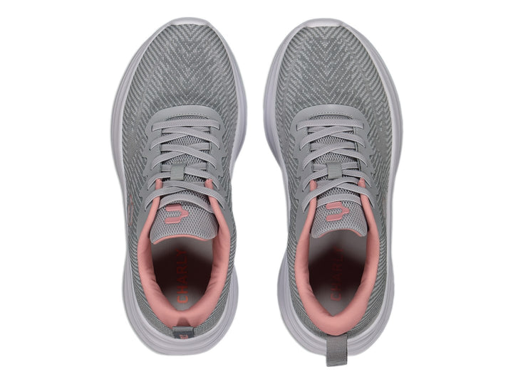 Tenis deportivos Charly color gris con suela blanca y detalles en rosa.
