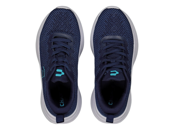 Tenis deportivos Charly color azul marino con suela blanca y logotipo en azul claro.