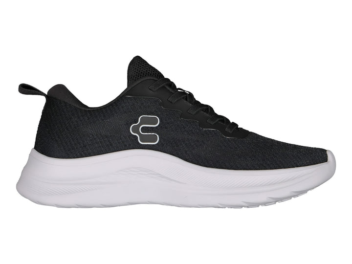 Tenis deportivos Charly color negro con suela blanca y logotipo lateral blanco.