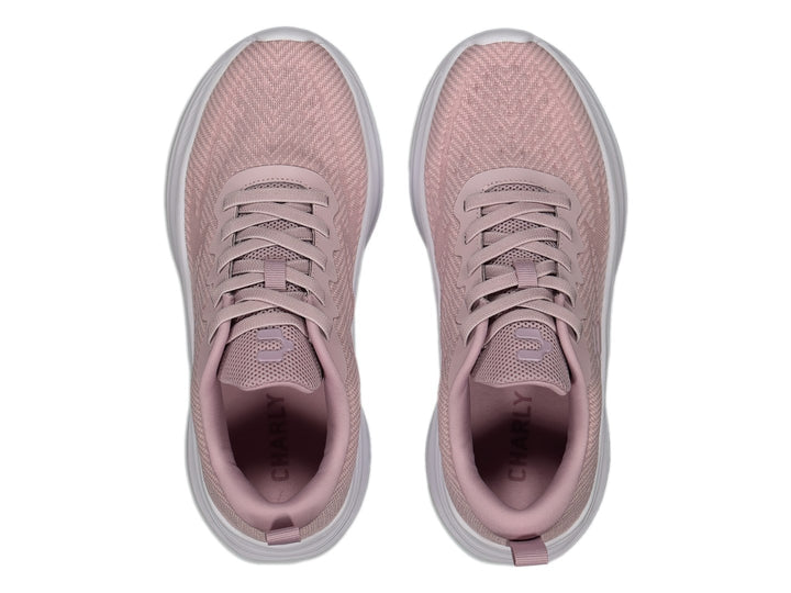 Tenis deportivos Charly en color rosa con suela blanca y tejido transpirable.