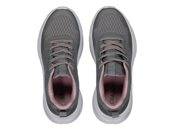 Tenis deportivos Charly color gris con suela blanca y detalles en rosa.