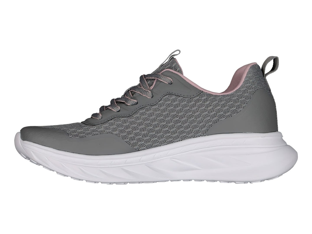 Tenis deportivos Charly color gris con suela blanca y detalles en rosa.