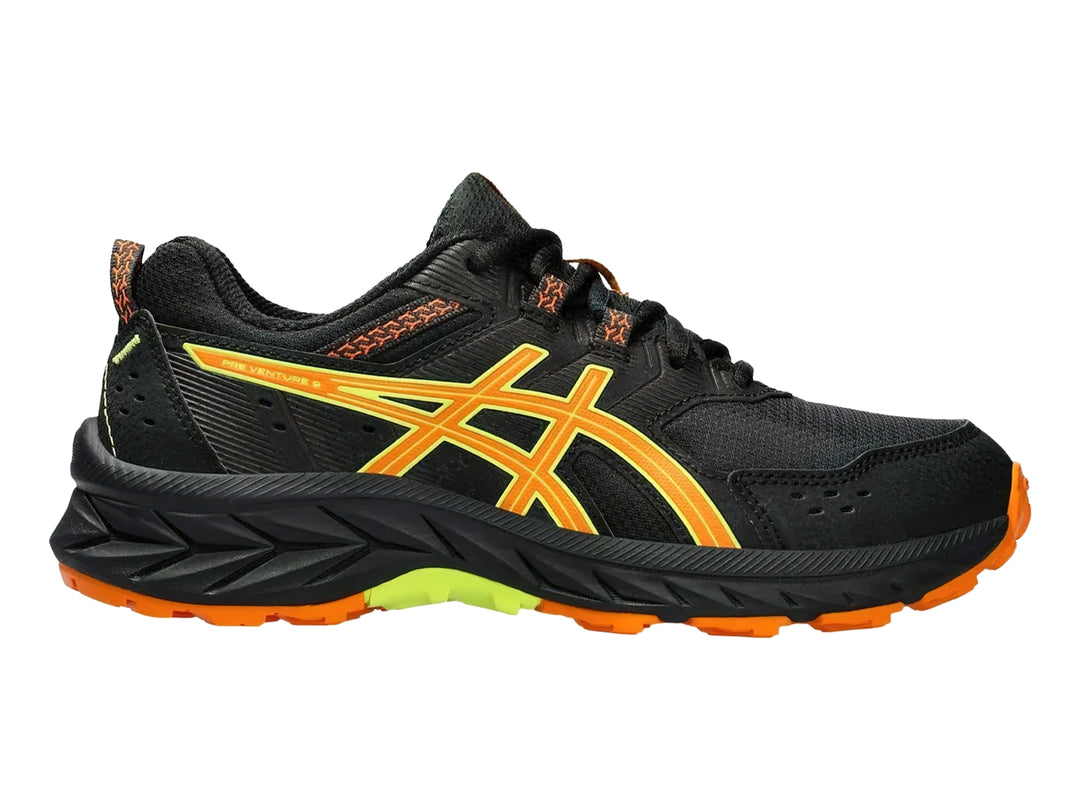 Tenis deportivos ASICS color negro con detalles en naranja y verde lima para niños.