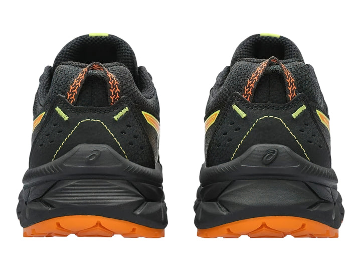 Tenis deportivos ASICS color negro con detalles en naranja y verde lima para niños.