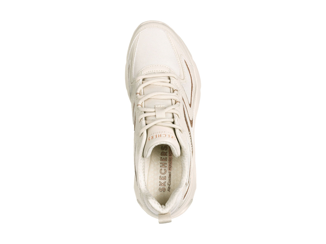 Tenis deportivos Skechers color blanco con detalles dorados y suela con cámara de aire visible.