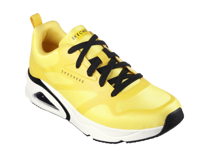 Tenis deportivos Skechers color amarillo con suela blanca y detalles en negro para niño.
