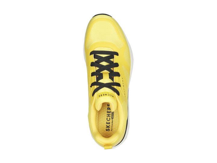 Tenis deportivos Skechers color amarillo con suela blanca y detalles en negro para niño.