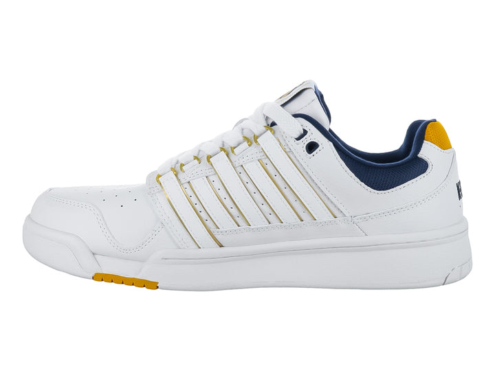 Tenis K-Swiss G-Staad en color blanco con detalles en dorado y azul marino.