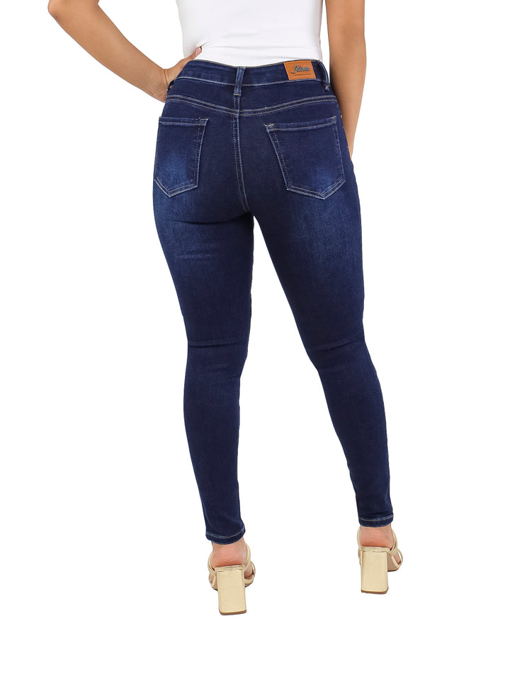 Pantalones jeans ajustados color azul marino con pequeños detalles brillantes distribuidos en toda la prenda.