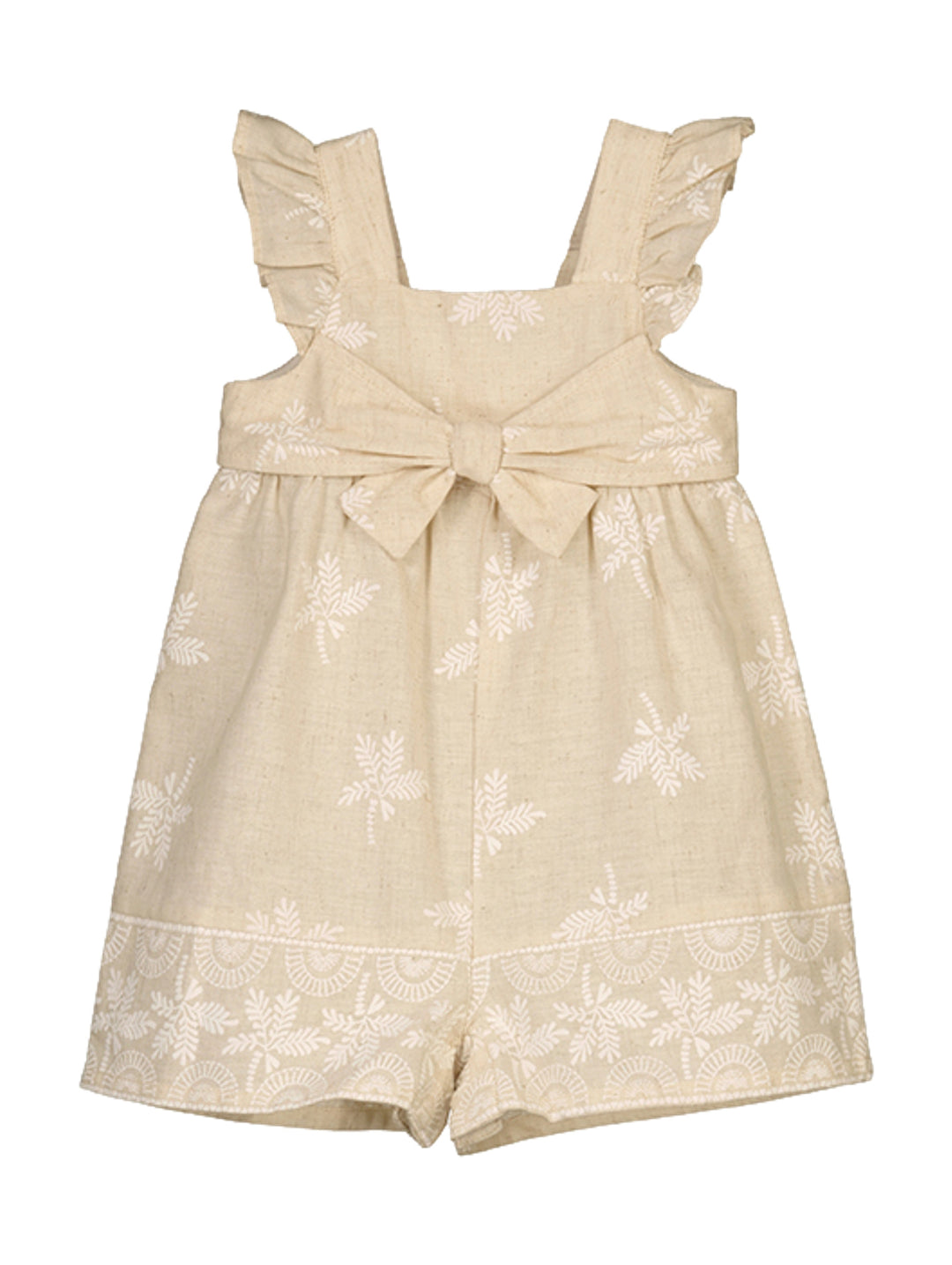 Mono color beige para niña con volantes en los hombros, lazo en la cintura y estampado floral blanco.