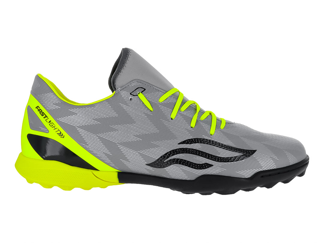 Zapato de fútbol Furia color gris con detalles en amarillo neón y suela negra.