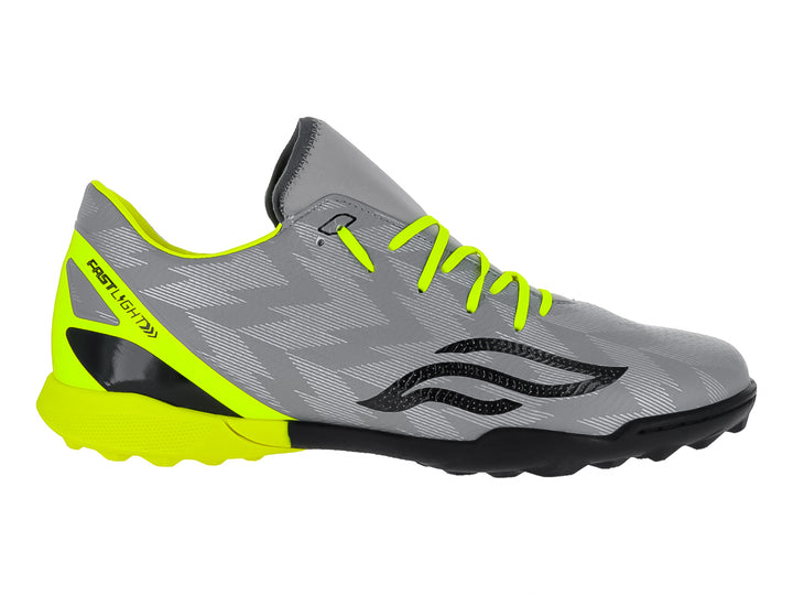 Zapato de fútbol Furia color gris con detalles en amarillo neón y suela negra.