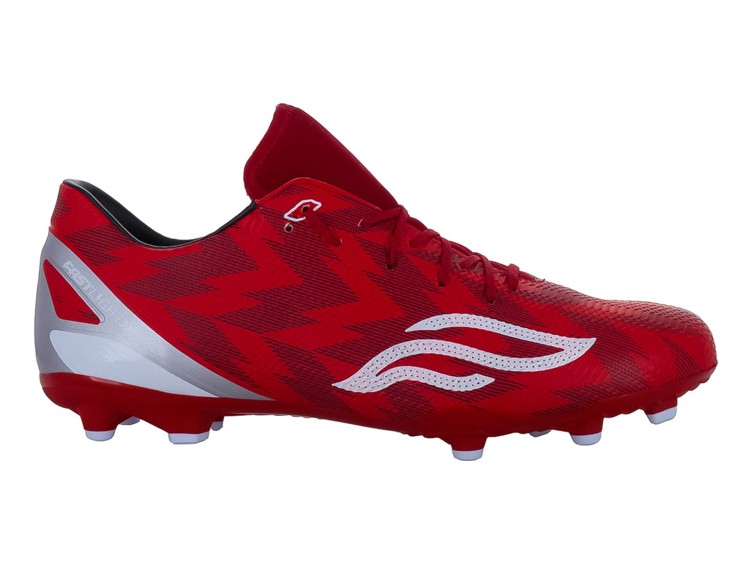 Zapato de fútbol Furia color rojo con detalles blancos y plateados para pasto.