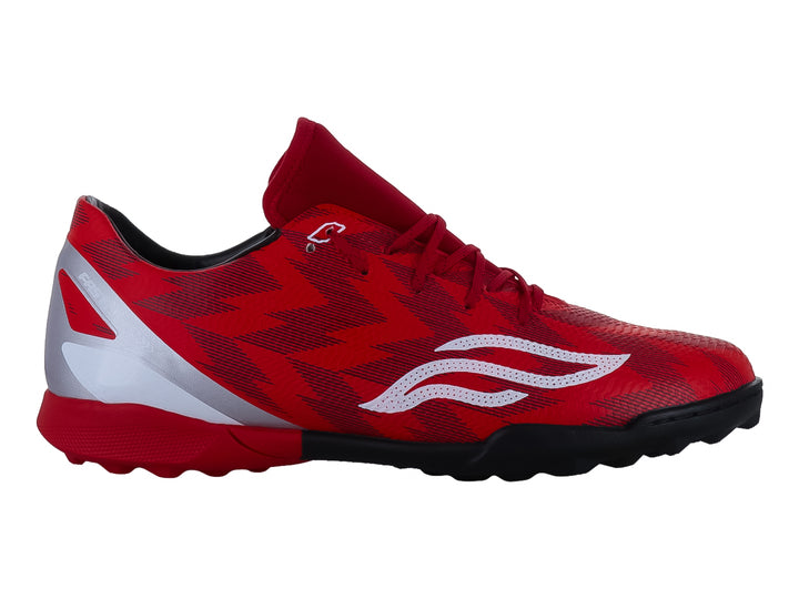Calzado de fútbol Furia en color rojo con detalles en blanco y suela negra.