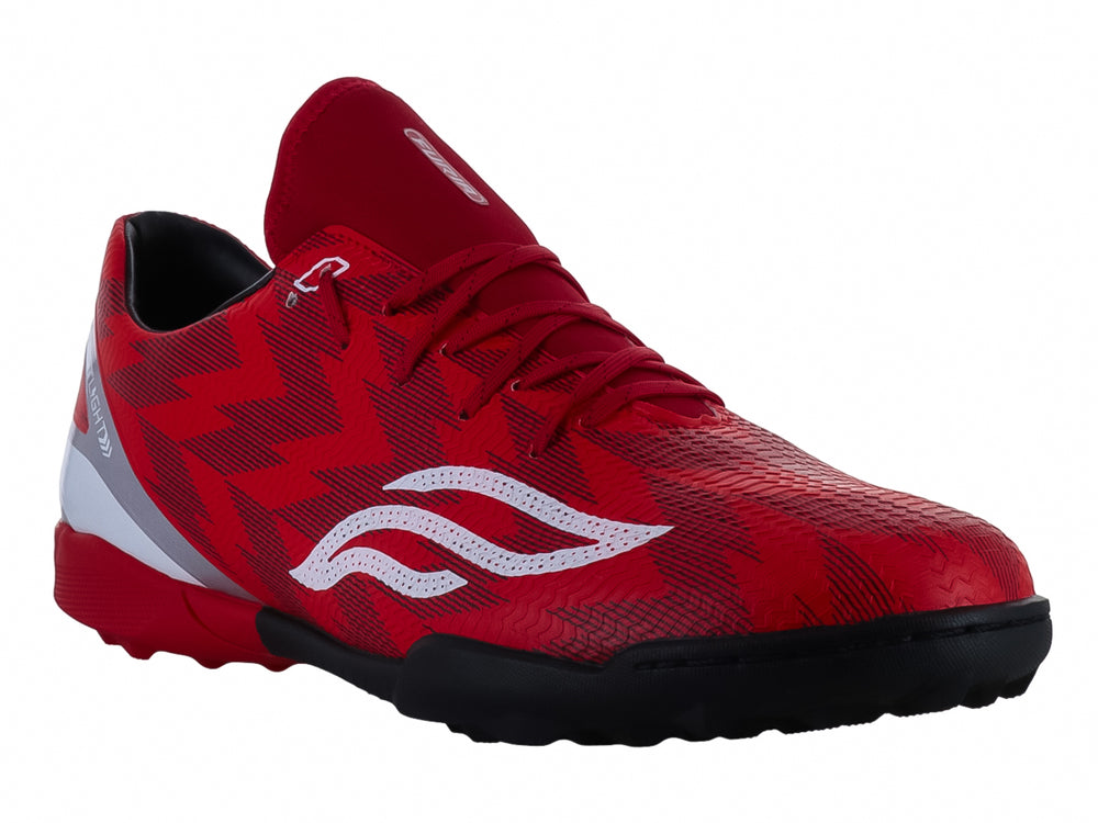 Calzado de fútbol Furia en color rojo con detalles en blanco y suela negra.