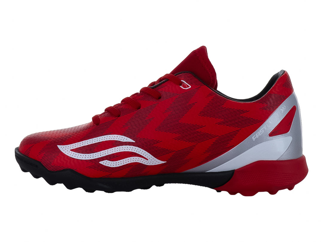 Zapato de fútbol Furia para niños en color rojo con detalles en blanco y plata y suela negra.