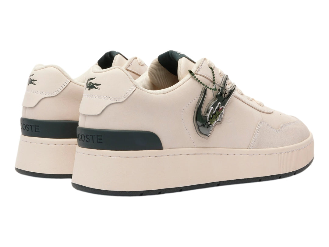 Tenis Lacoste color blanco roto con detalles en verde oscuro y suela ancha.