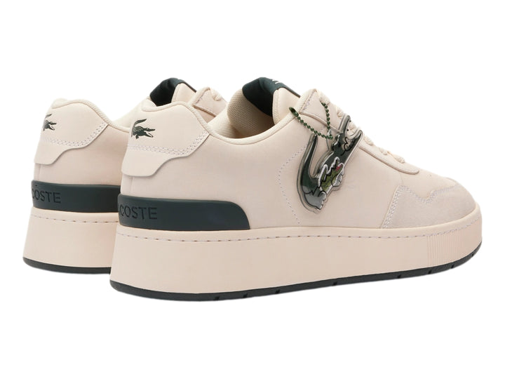 Tenis Lacoste color blanco roto con detalles en verde oscuro y suela ancha.
