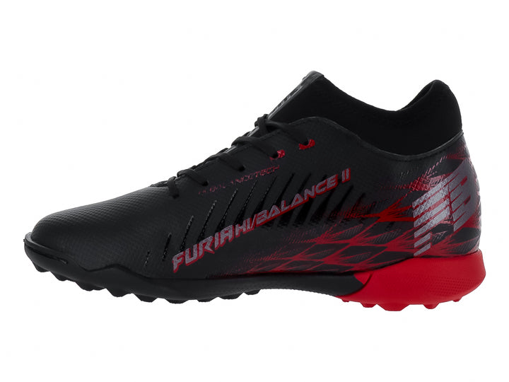 Zapato de fútbol para niño marca Furia en color negro con detalles rojos y suela para pasto sintético.