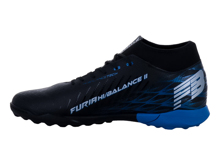 Zapato de fútbol Furia color negro con detalles y suela azul para pasto sintético.