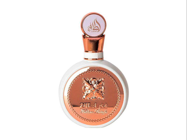 Perfume Lattafa Fakhar Woman en frasco blanco y oro rosa con caja decorada a juego.
