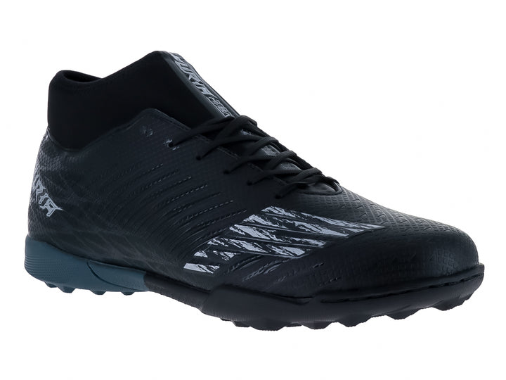 Calzado de fútbol Furia en color negro con detalles grises y suela para césped sintético.