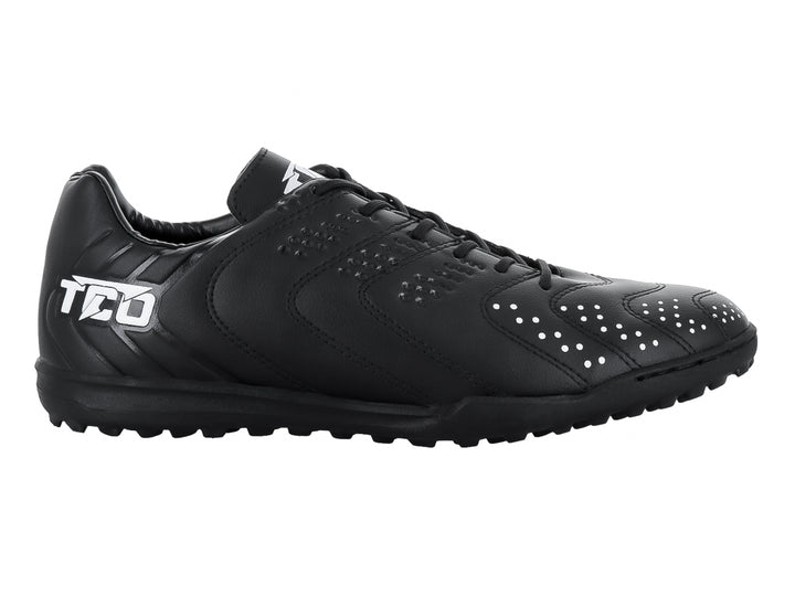 Zapato de fútbol Leon Trucco FT74 color negro con detalles en blanco y suela para pasto sintético.
