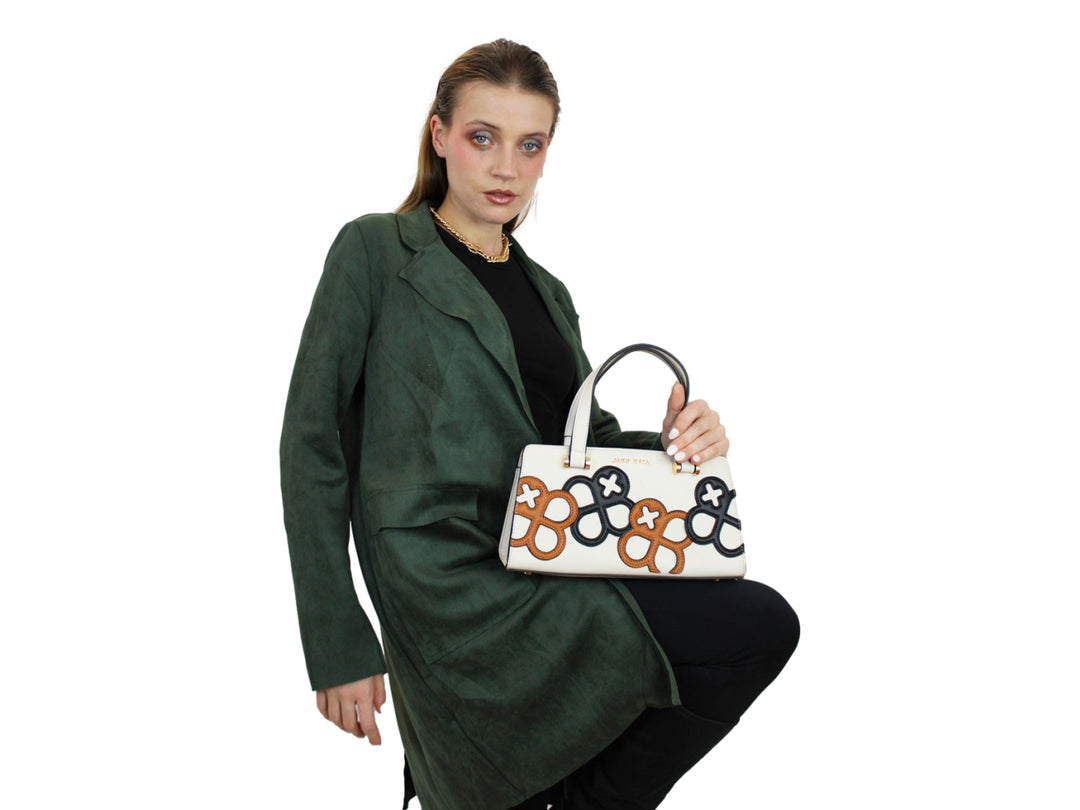 Bolso beige Jaime Ibiza con diseños geométricos en negro y marrón, asas superiores y correa ajustable.