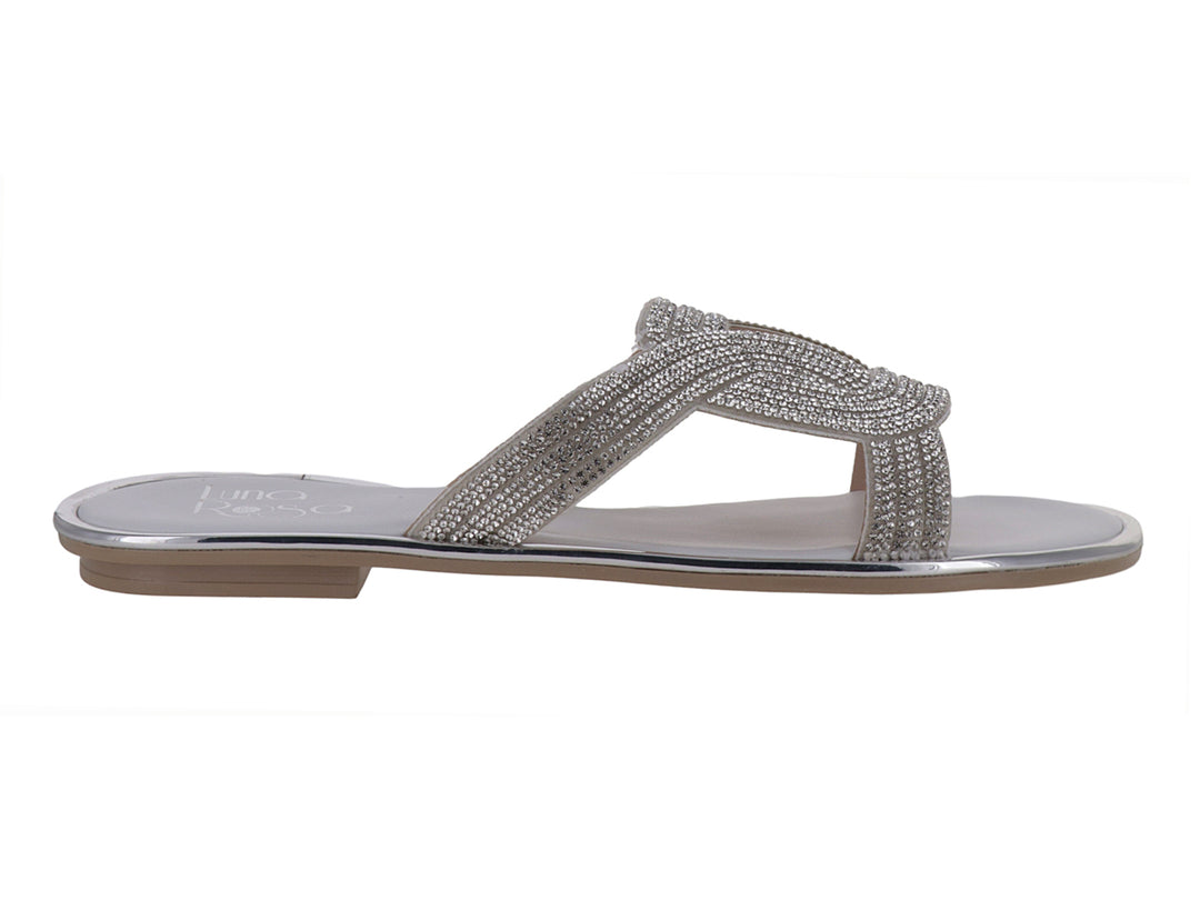 Sandalia plana color plata con tiras cruzadas decoradas con brillos para niña.