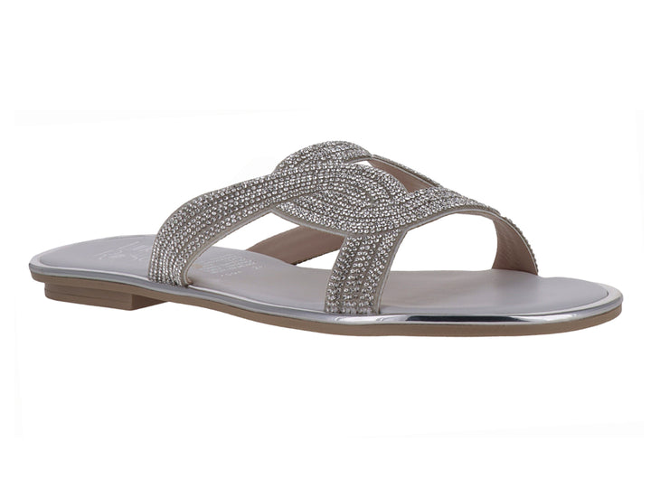 Sandalia plana color plata con tiras cruzadas decoradas con brillos para niña.