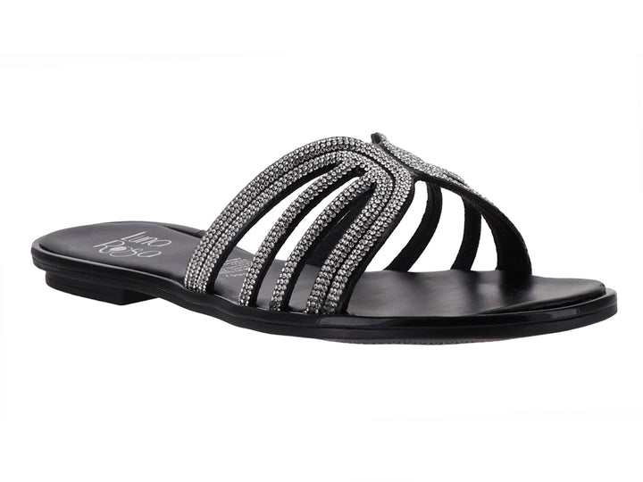 Sandalia plana color negro con tiras decoradas con brillantes plateados.