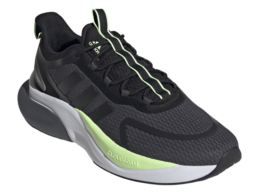 Tenis deportivos Adidas en color gris oscuro y negro con detalles en verde neón y suela blanca.