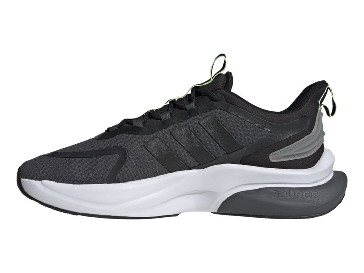 Tenis deportivos Adidas en color gris oscuro y negro con detalles en verde neón y suela blanca.