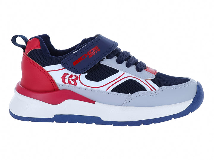Zapato deportivo infantil marca BICHOS en colores azul marino, gris y rojo con suela blanca y cierre de velcro.