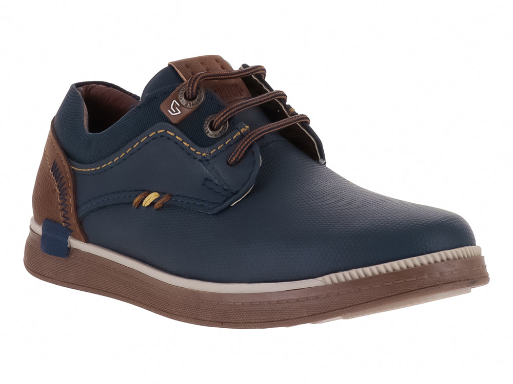 Zapato casual para Niño en color azul marino con detalles y suela en color café.