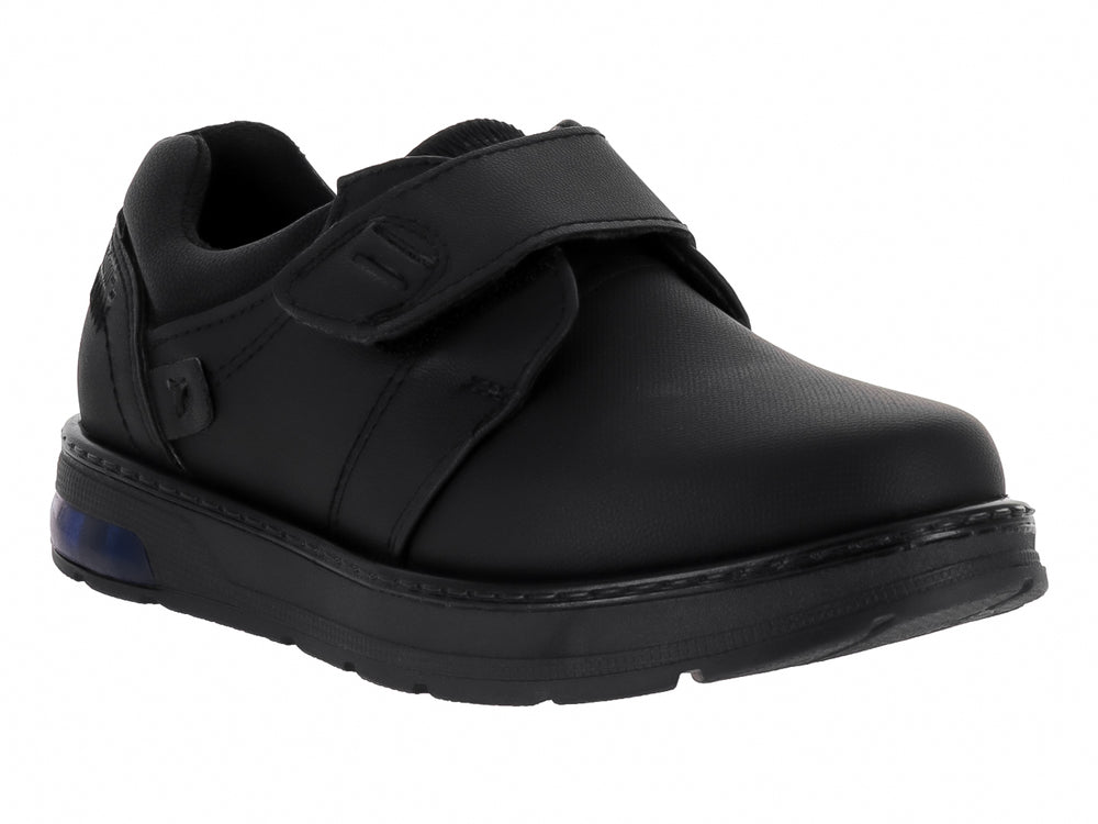 Zapato infantil negro con correa de velcro y detalle azul en la suela.