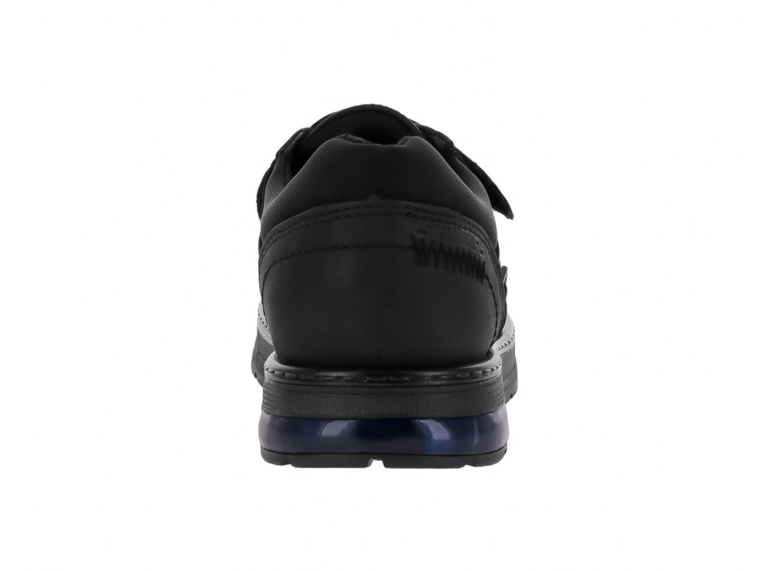 Zapato infantil negro con correa de velcro y detalle azul en la suela.