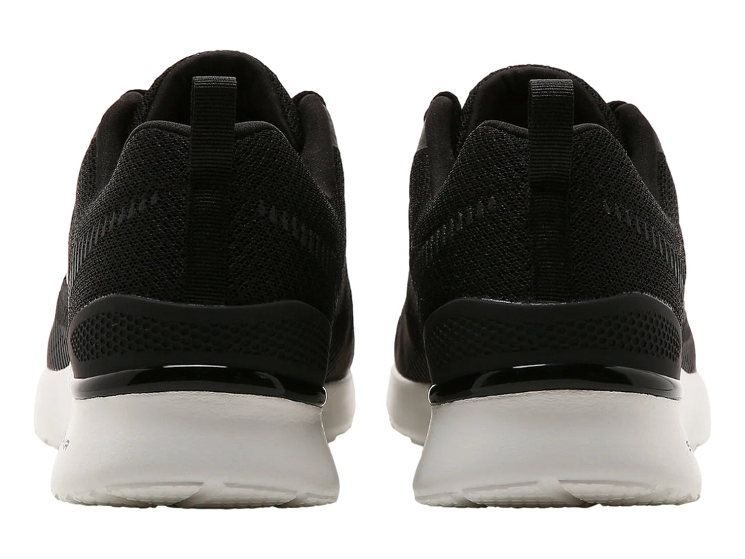 Tenis deportivos Skechers color negro con suela blanca y detalles en malla.