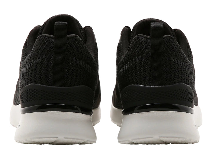 Tenis deportivos Skechers color negro con suela blanca y detalles en malla.