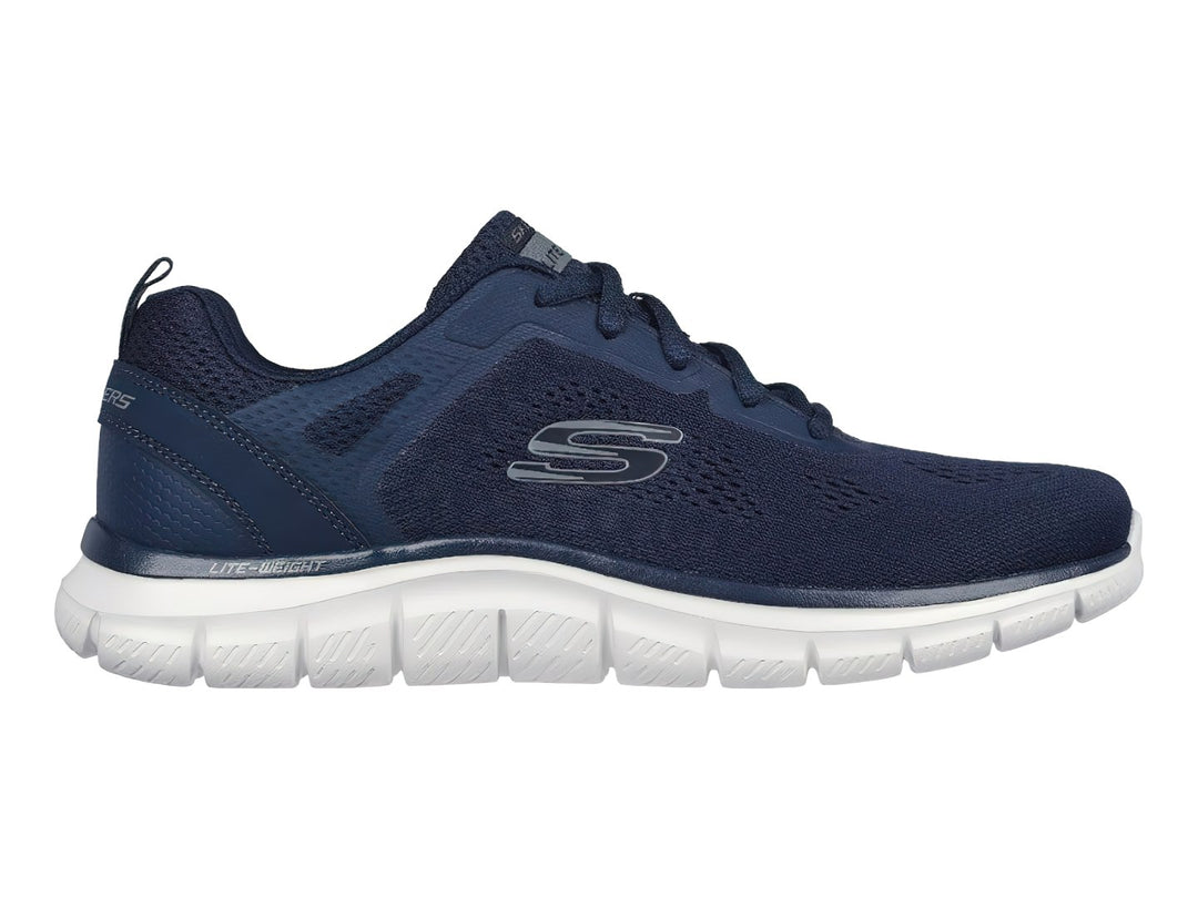 Tenis deportivos Skechers en color azul marino con suela blanca y detalles en malla.
