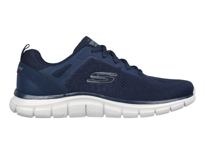 Tenis deportivos Skechers en color azul marino con suela blanca y detalles en malla.
