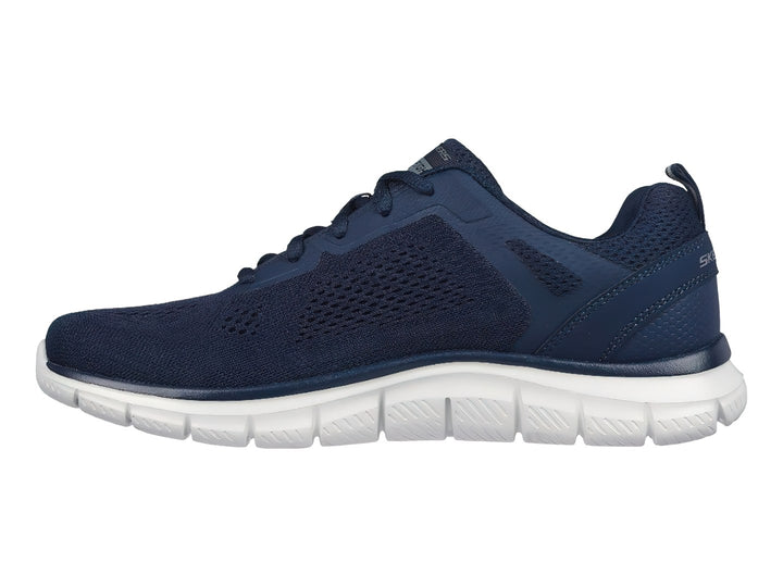 Tenis deportivos Skechers en color azul marino con suela blanca y detalles en malla.