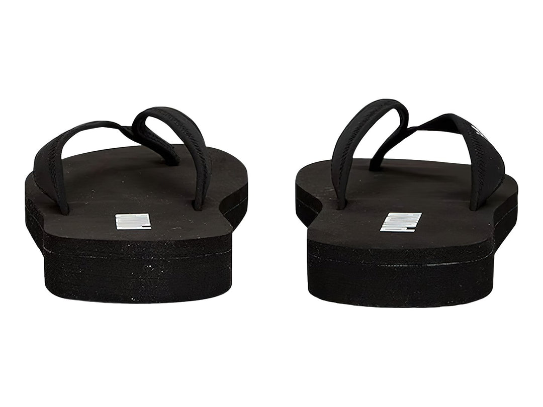 Sandalias tipo flip-flop PUMA en color negro con logotipo blanco en la plantilla.